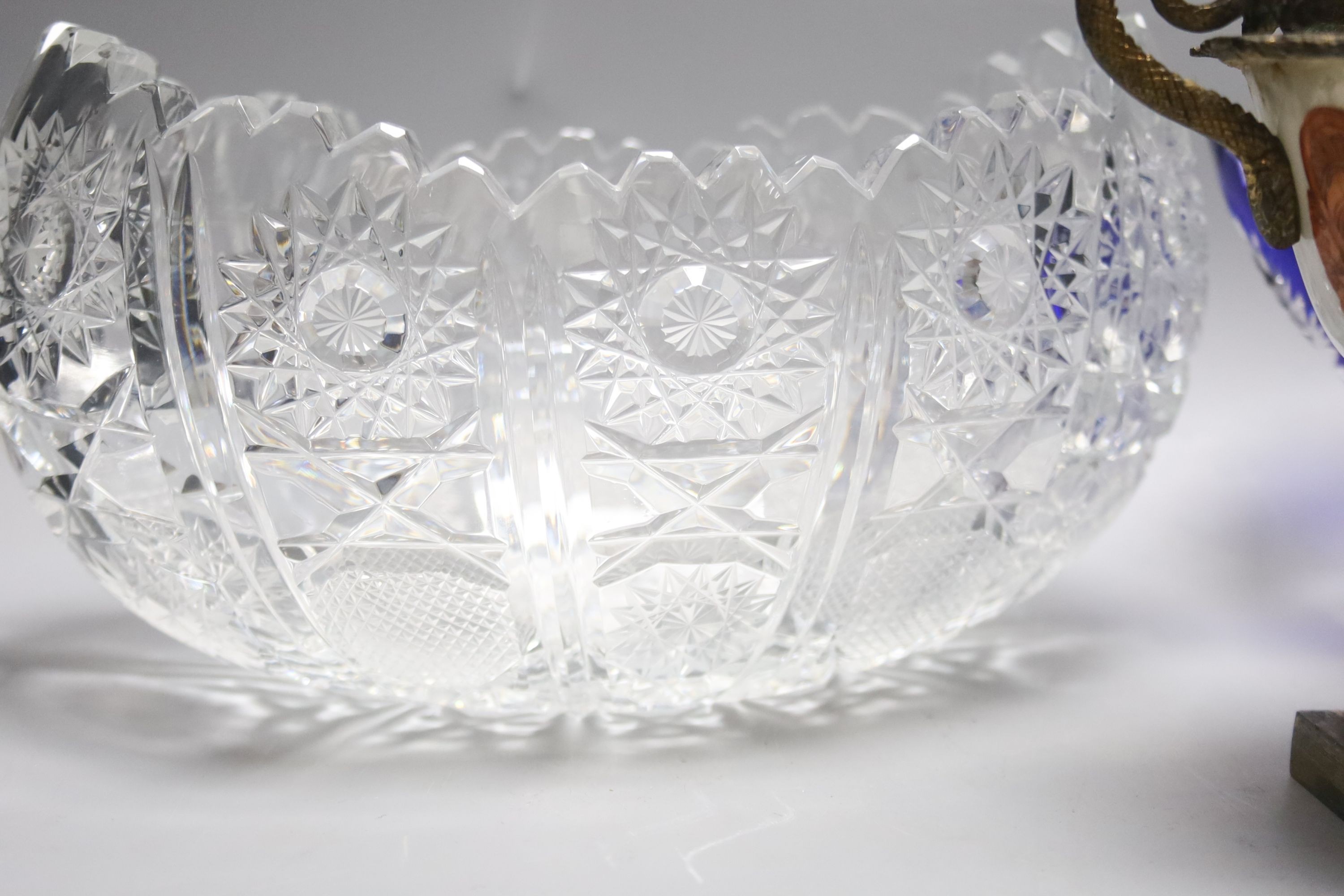 Two cut glass bowls and a Chinese brass mounted cup, 16cm